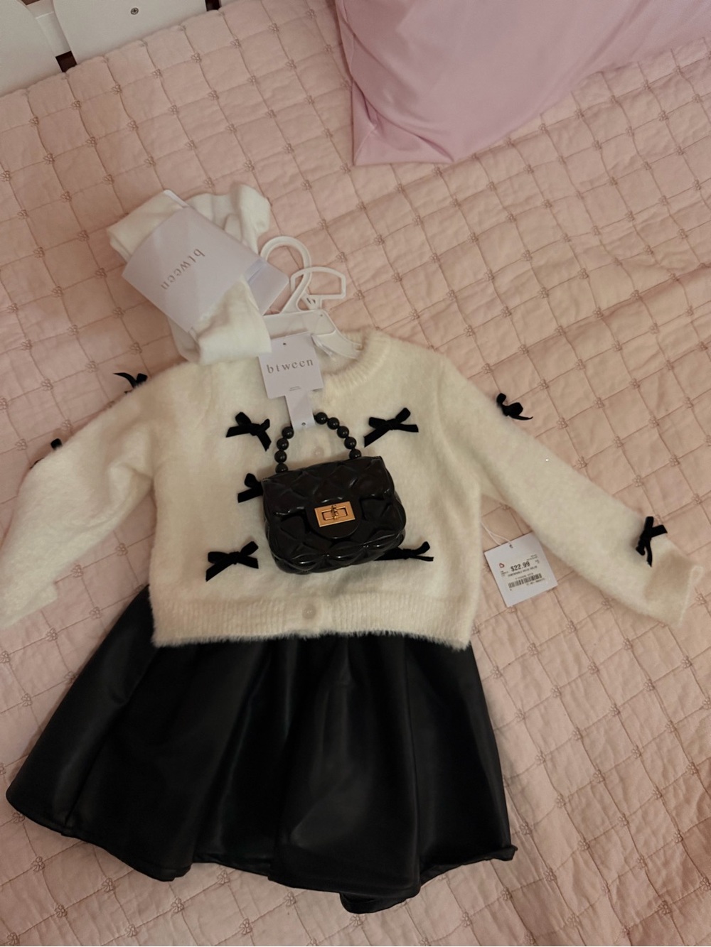 Kids Cream Sweater with Black Bow Accents and Black skirt and Bag